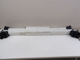 a piece of paper on a white table with black handles