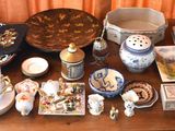 a table with a lot of dishes and plates on it