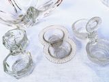 a lot of glass items sitting on a table