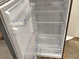 an open refrigerator in the middle of a room