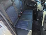 the back seats of a car with a dog in the back of it