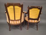 pair of antique chairs with yellow upholstered upholstered cushions