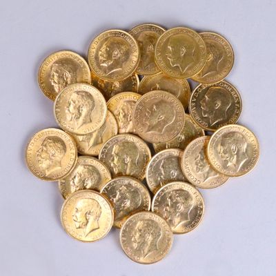a pile of gold coins on a white surface