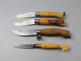 several knives are lined up in a row on a table