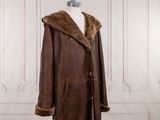 an image of a brown leather coat on a mannequin mannequin