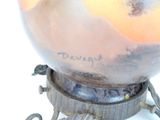 a vase that has a bird on it with writing on it