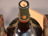 a bottle of wine that has a chain around it