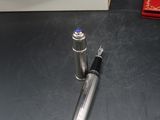 a pen that is sitting on a table next to a box