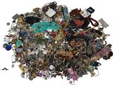 a pile of assorted jewelry sitting on top of a table