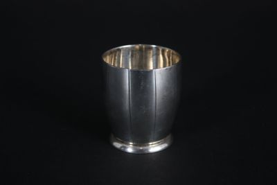 an image of a silver cup on a black background