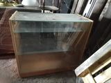 an image of a glass display case in a warehouse