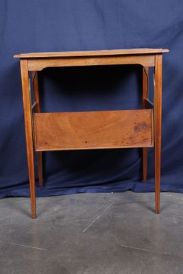 a small wooden table with a drawer on top of it