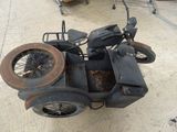 an old motorcycle with a side car attached to it