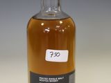 a bottle of alcohol that is sitting on a table