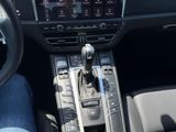 a person sitting in the driver ' s seat of a car