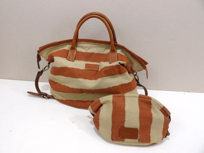 striped handbag and pouch on a white surface