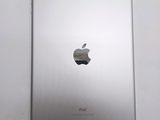 the back of an apple ipad with the apple logo on it