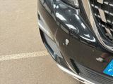 a close up of a car ' s grille with a sticker on it