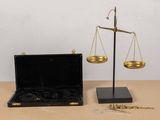 an image of a scale with two gold scales on top of it