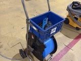 a blue cart that is sitting on the floor