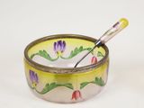 a close up of a small bowl with a spoon in it