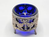 an image of a blue glass bowl on a stand
