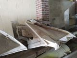several pieces of wood are stacked on top of each other in a room