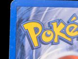 a close up of a pokemon card on a table