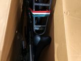 a bike in a box with a handlebar attached to it