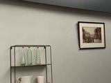 a shelf with cups and mugs on it in the corner of a room