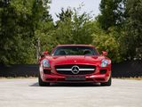 the red mercedes sls is parked in the parking lot