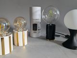 a lot of different types of light bulbs on the table