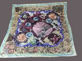 a picture of a quilt with a picture of a woman