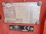 a close up of a sign on the side of a tractor