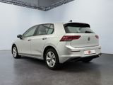the rear end of a white volkswagen e - golf parked in a garage