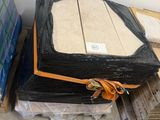 a box of cardboard and a box of cardboard sitting on a pallet