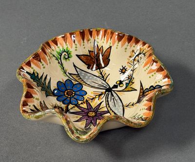 a small bowl with a design of flowers on it