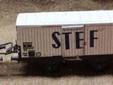 three toy train cars that are sitting on the ground