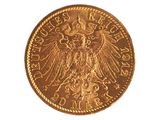 l'image d'une pièce d'or ornée d'un aigle