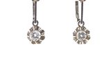 pair of silver earrings with crystal stones on a white background