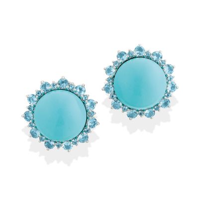 a pair of turquoise and white topaze earrings