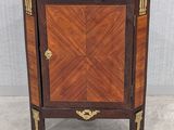 an image of a corner cabinet with a marble top