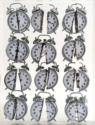 many clocks that are arranged in a row on the table