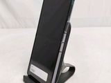 a cell phone that is sitting on a stand