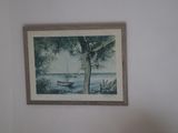a picture of a painting hanging on the wall above a bed