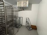 a room with a bunch of racks of food in it