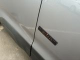a close up of a car door with a sticker on it