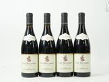 six bouteilles de vin sont alignées sur une surface blanche