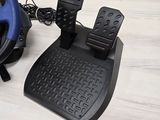 two pedals and a steering wheel on a table