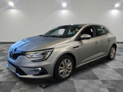 a silver car parked in a room with a checkered floor